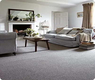 Minimalist-living-room-with-oak-hardwood-floors-gray-sectional-and-wall-mounted-TV
