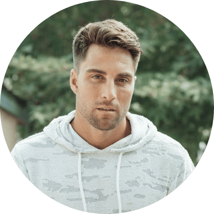 Man-in-a-camo-hoodie-outdoors