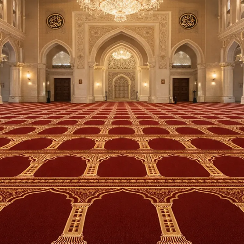 Elegant mosque interior featuring red prayer carpets with golden arched patterns, ornate pillars, and grand chandeliers