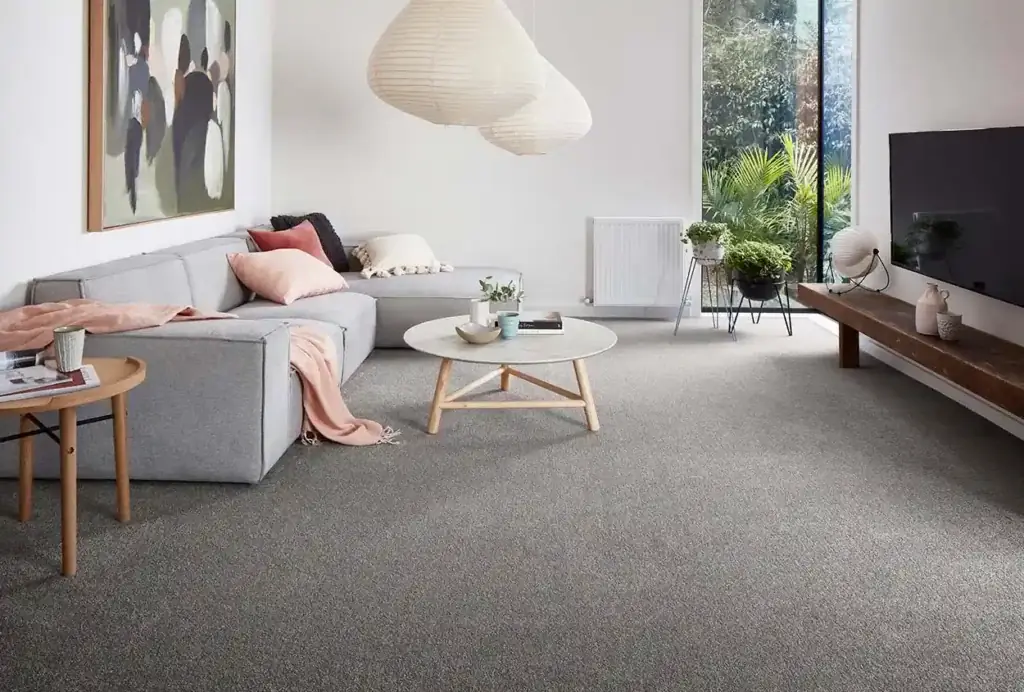 Wall to wall carpet installation in modern grey living room